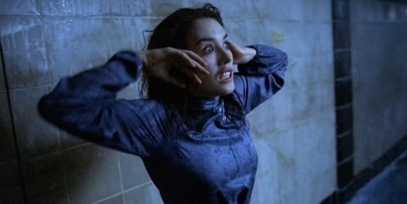A still from the movie Possession, showing Isabelle Adjani absolutely freaking the fuck out in a subway station 